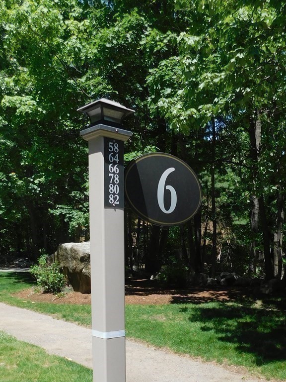 80 Mountain Gate Road, Unit 80 Ashland, MA 01721 - Photo 41 of 42 a front view of a house with garden