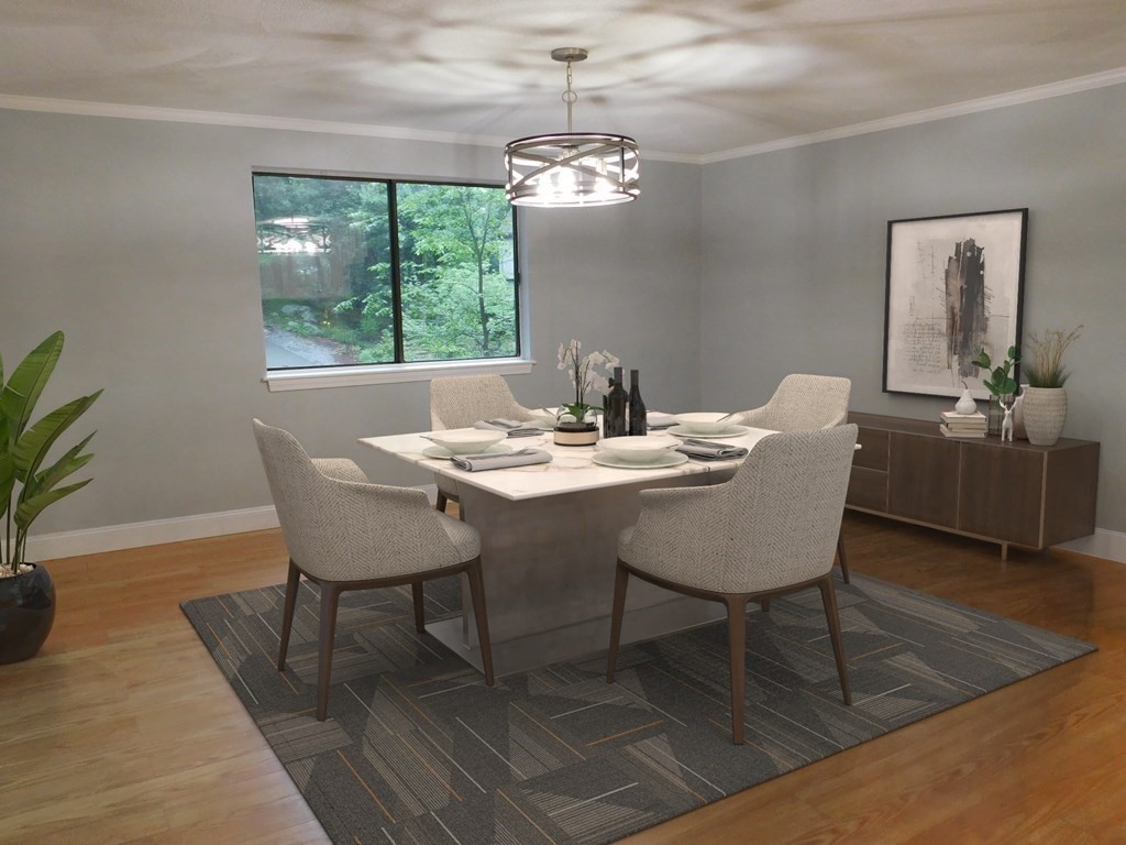 80 Mountain Gate Road, Unit 80 Ashland, MA 01721 - Photo 10 of 42 a dining room with furniture a large window and wooden floor