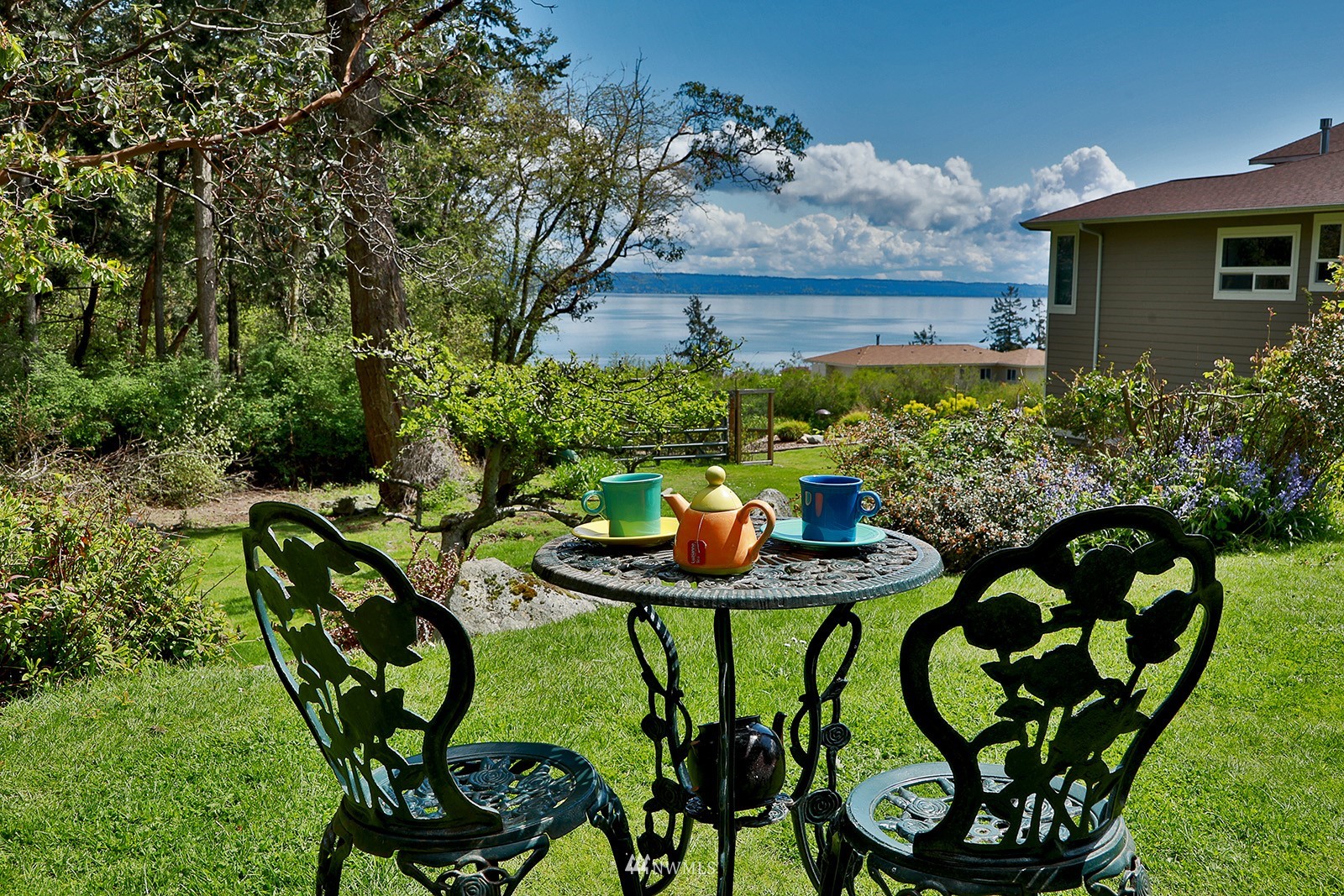 1294 Bonnie View Acres Road Oak Harbor, WA 98277 - Photo 11 of 39 a view of a chairs and table in a backyard