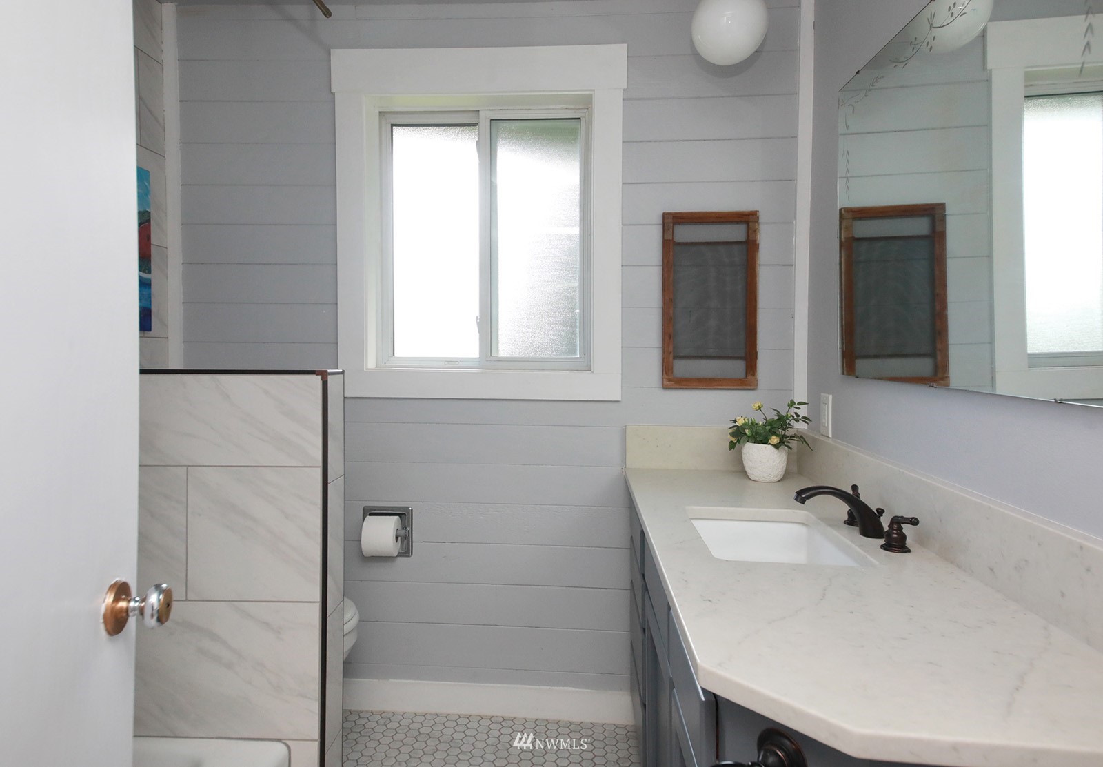 1294 Bonnie View Acres Road Oak Harbor, WA 98277 - Photo 22 of 39 a bathroom with a sink and mirror