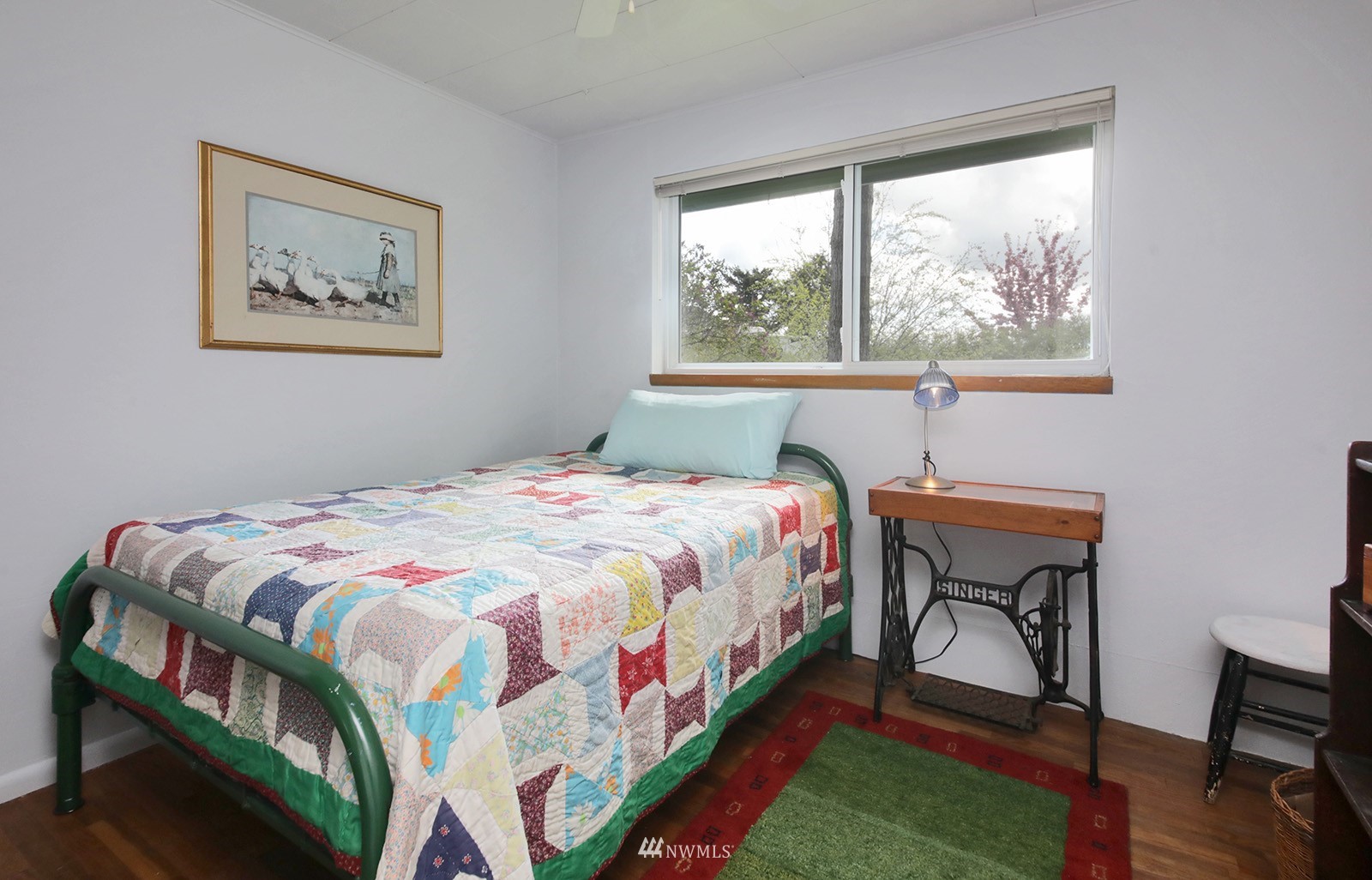 1294 Bonnie View Acres Road Oak Harbor, WA 98277 - Photo 24 of 39 a bedroom with a bed a table and a window
