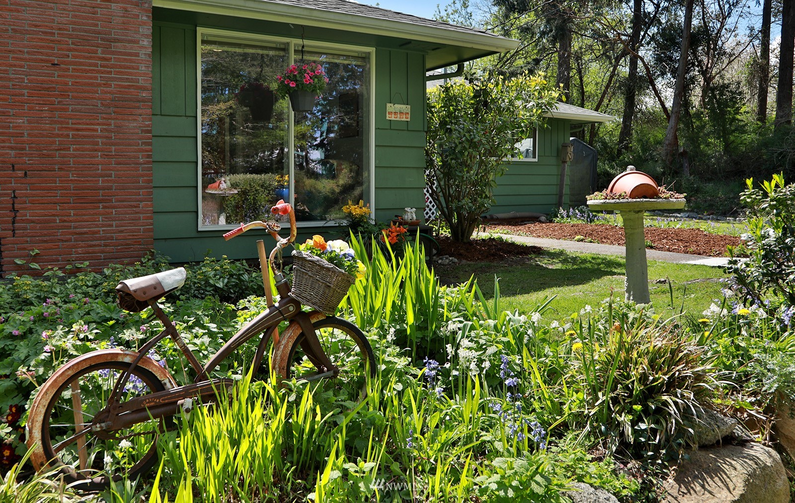 1294 Bonnie View Acres Road Oak Harbor, WA 98277 - Photo 27 of 39 a front view of a house with garden