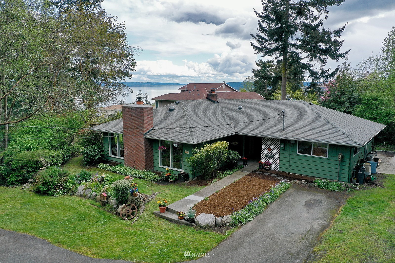 1294 Bonnie View Acres Road Oak Harbor, WA 98277 - Photo 34 of 39 a aerial view of a house next to a big yard and large trees