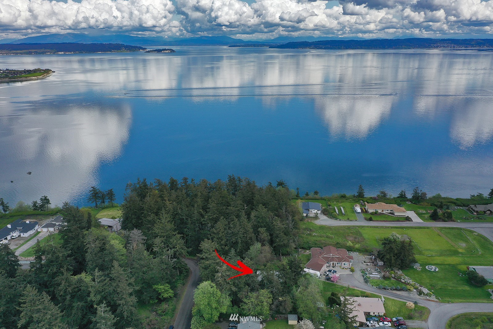 1294 Bonnie View Acres Road Oak Harbor, WA 98277 - Photo 35 of 39 a view of a lake with a houses