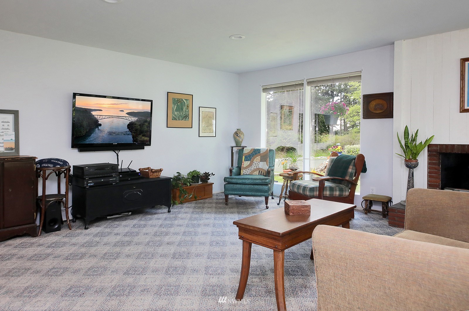1294 Bonnie View Acres Road Oak Harbor, WA 98277 - Photo 6 of 39 a living room with furniture and a flat screen tv