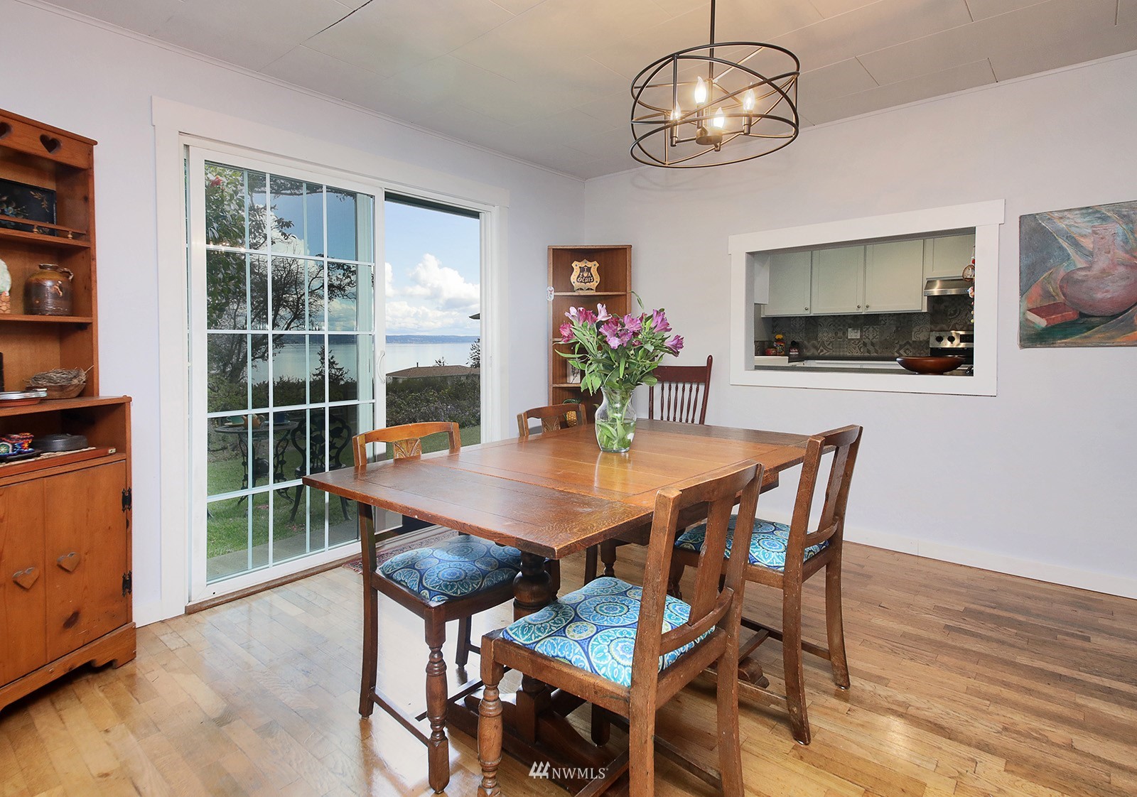 1294 Bonnie View Acres Road Oak Harbor, WA 98277 - Photo 10 of 39 a view of a dining room with furniture a chandelier and wooden floor