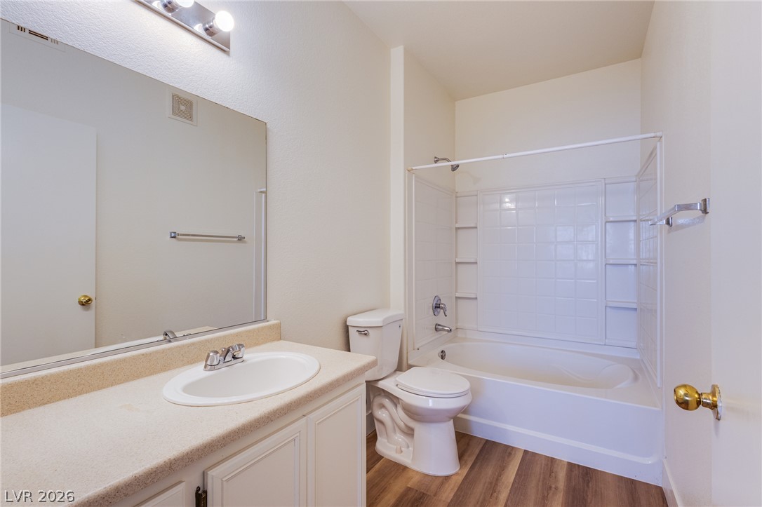9050 West Warm Springs Road, Unit 1011 Las Vegas, NV 89148 - Photo 16 of 32 The bathroom presents a combined shower and tub, complete with a clean white tile surround.