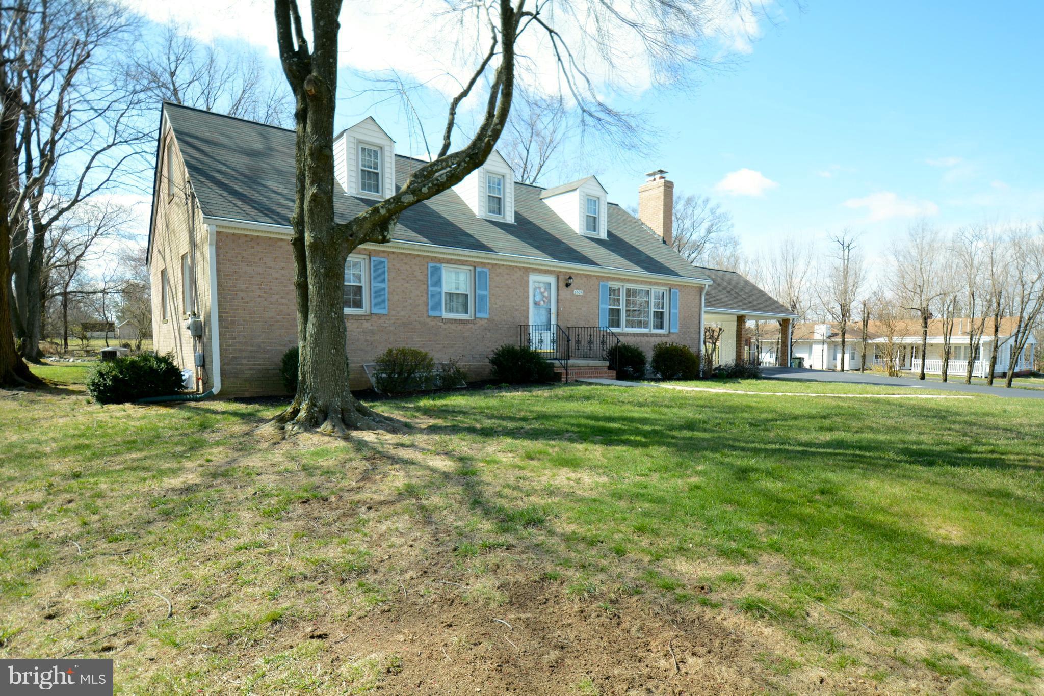 6505 Kalmia Street Springfield, VA 22150 - Photo 2 of 30 a front view of a house with a yard