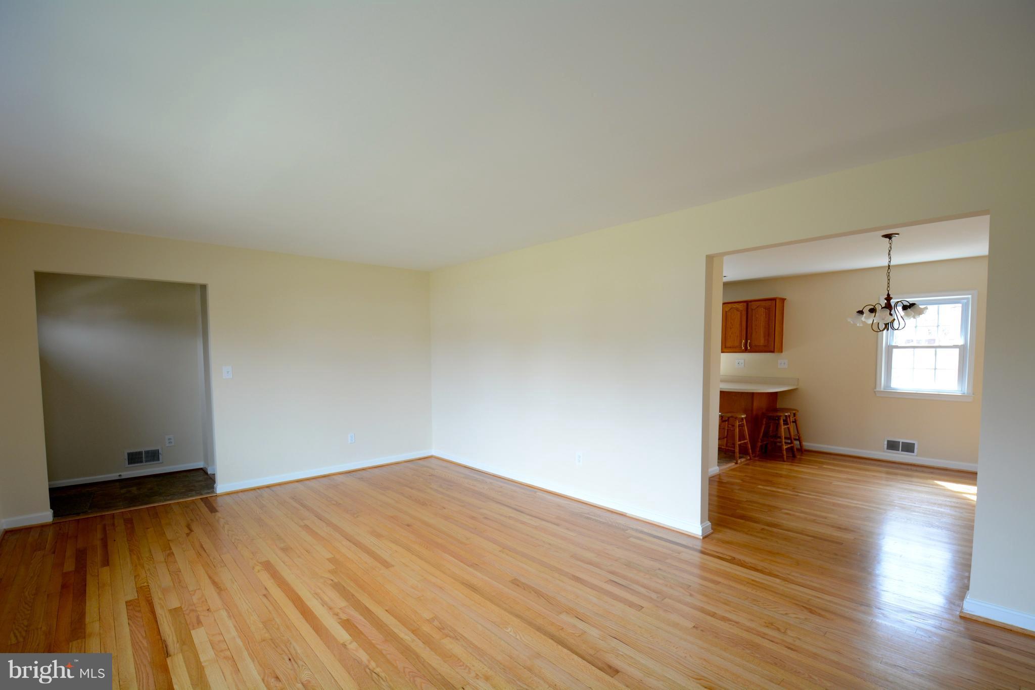 6505 Kalmia Street Springfield, VA 22150 - Photo 11 of 30 a view of empty room with wooden floor and fan