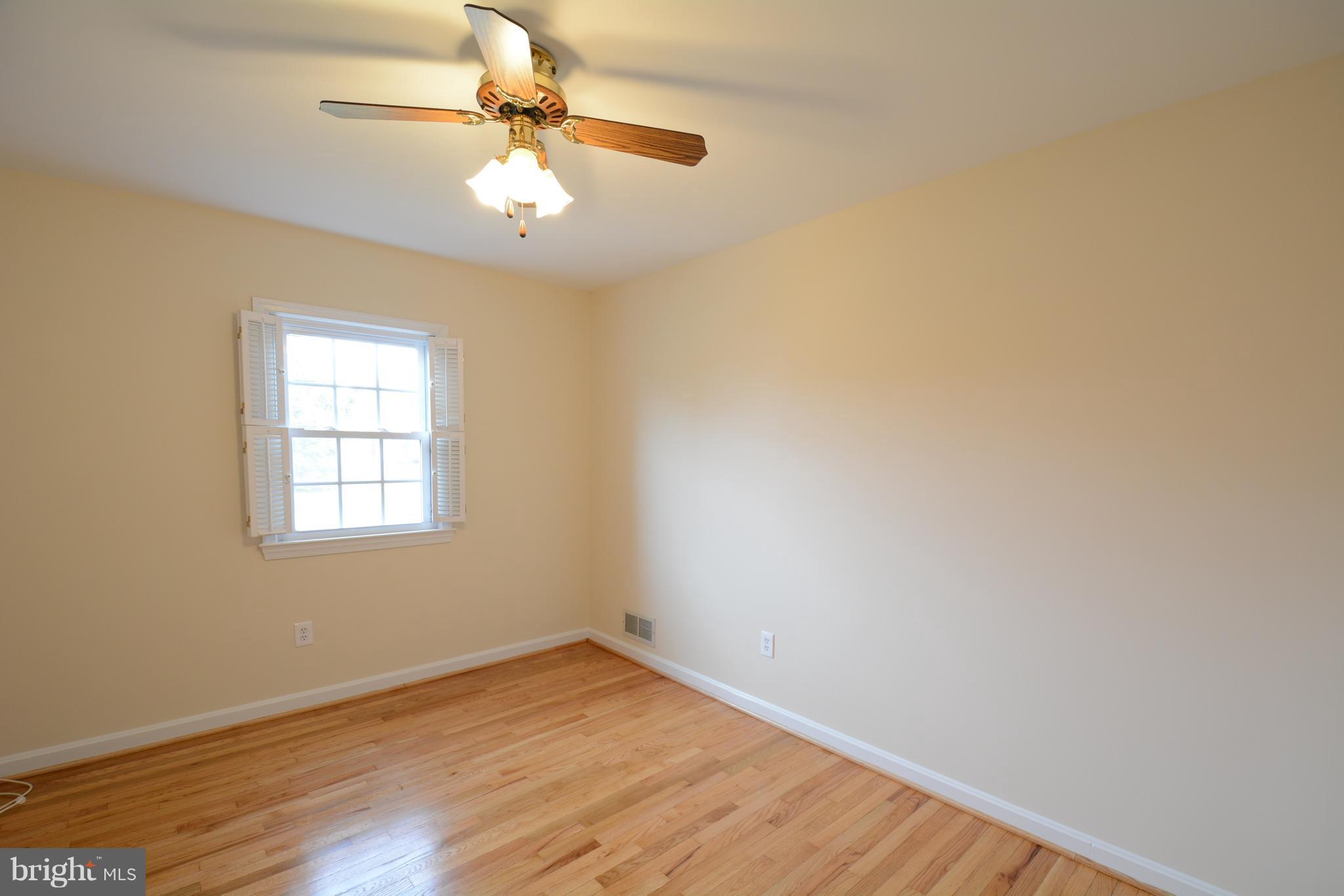 6505 Kalmia Street Springfield, VA 22150 - Photo 15 of 30 wooden floor in an empty room with a window