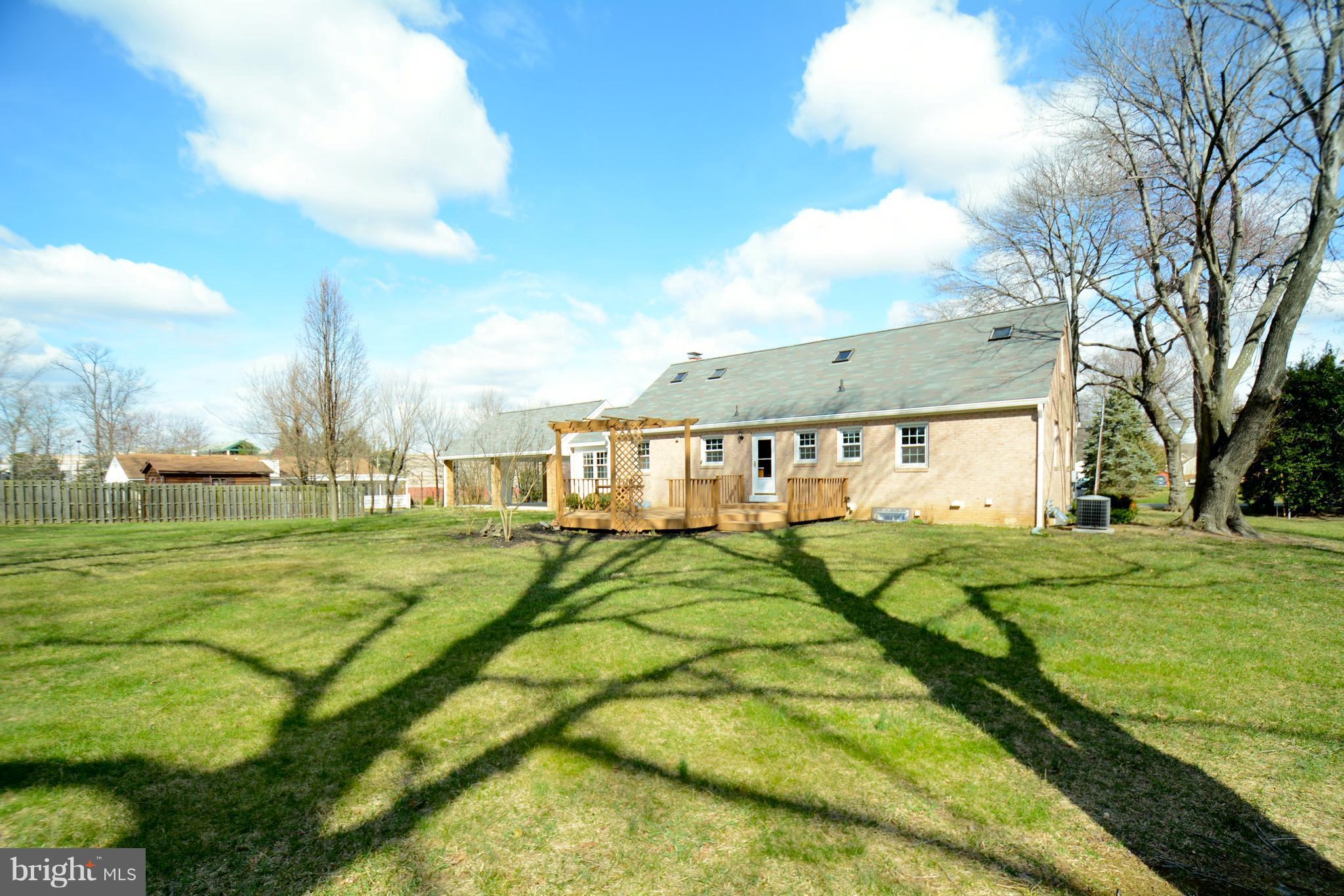 6505 Kalmia Street Springfield, VA 22150 - Photo 29 of 30 a view of a big house with a big yard and a large trees