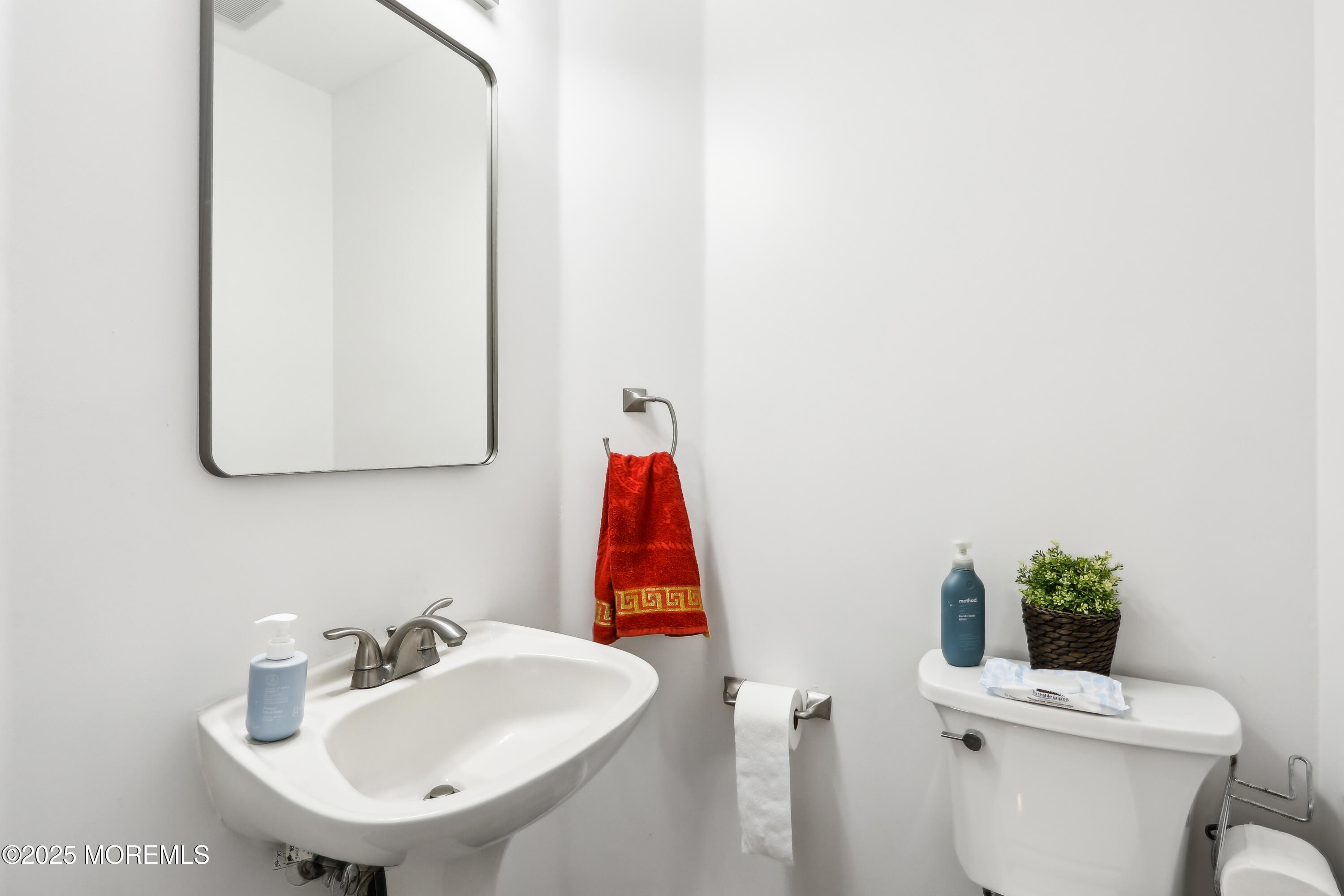 15 Pemberton Drive Matawan, NJ 07747 - Photo 25 of 67 a bathroom with a sink toilet and a mirror