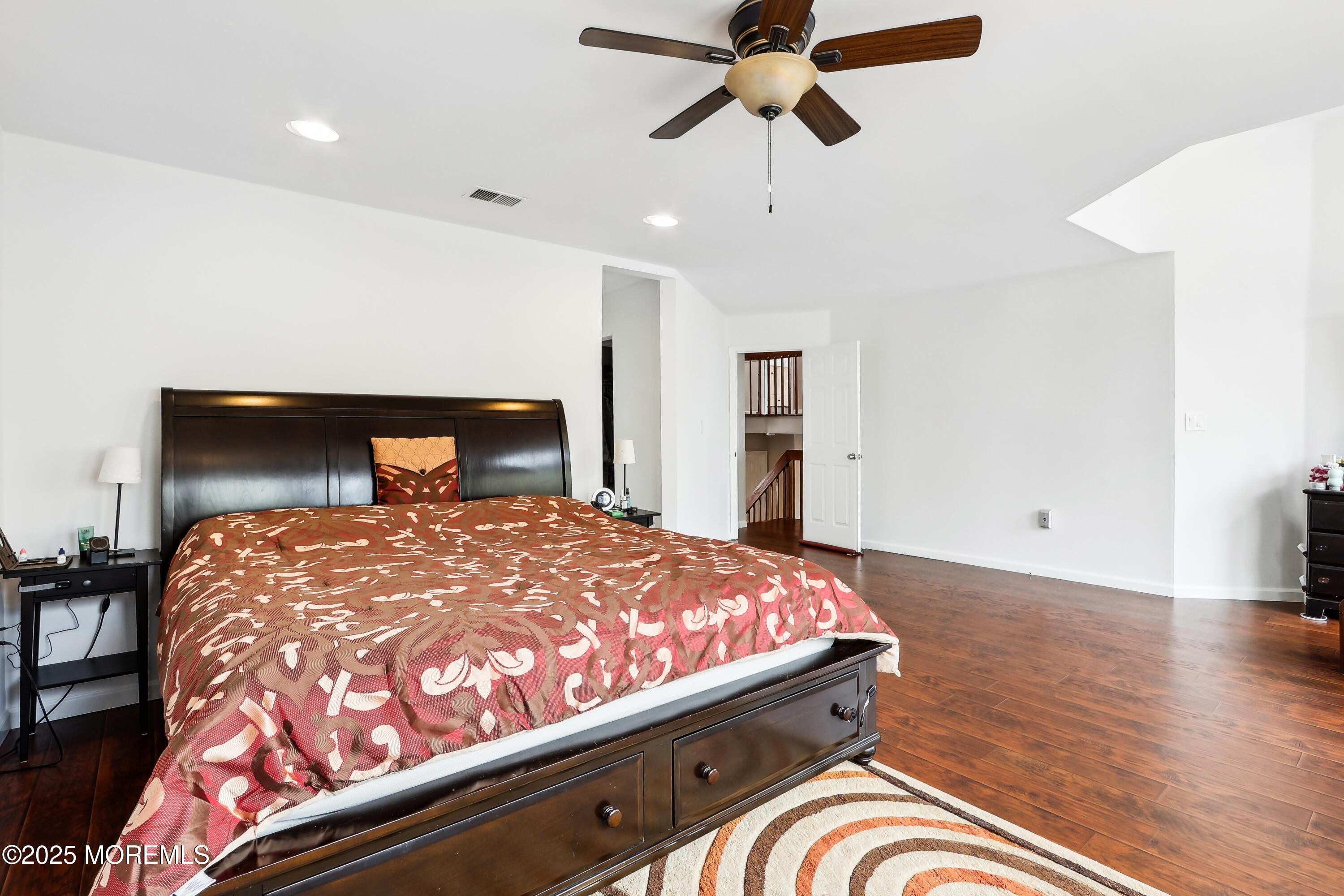 15 Pemberton Drive Matawan, NJ 07747 - Photo 28 of 67 a bedroom with a bed and wooden floor