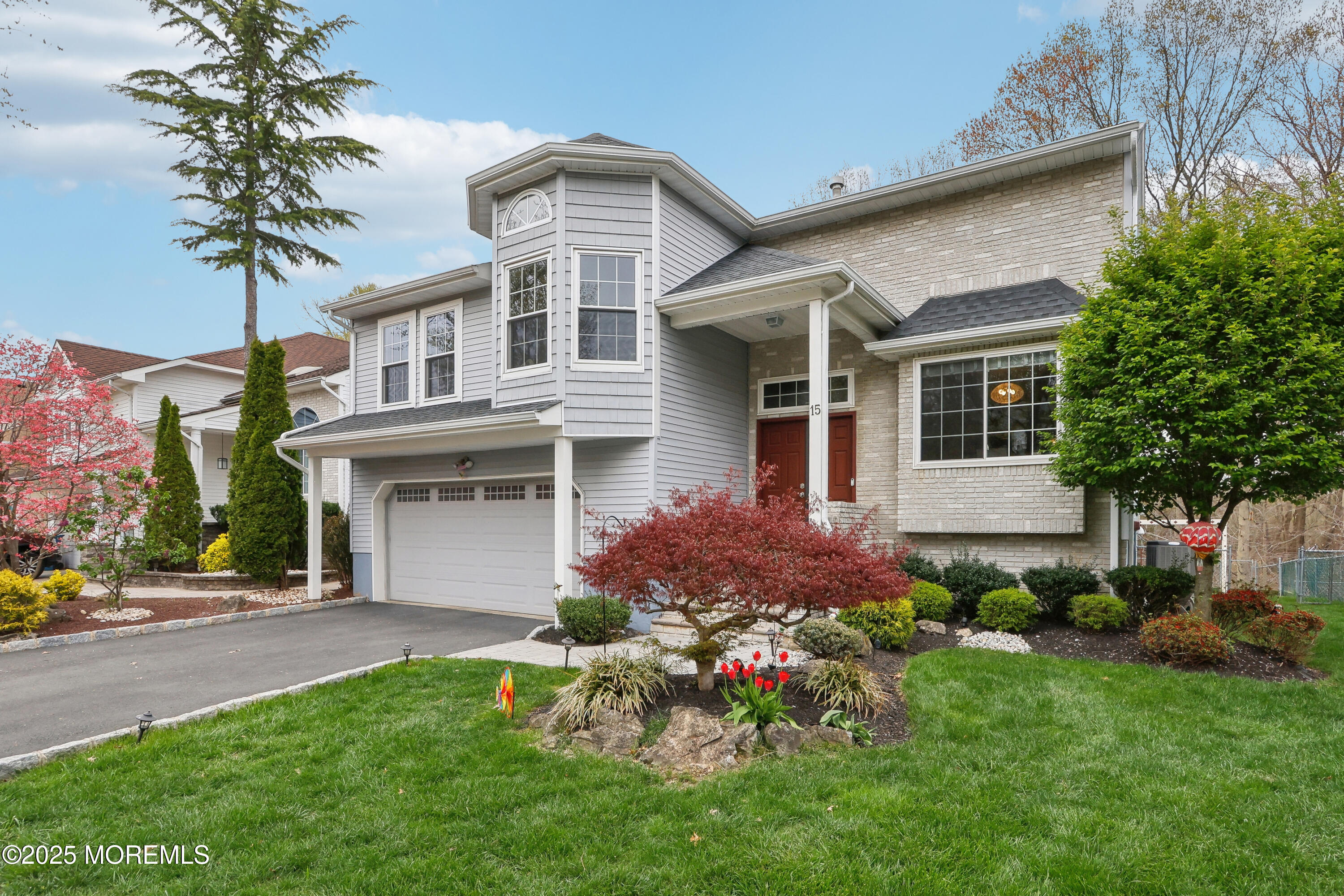15 Pemberton Drive Matawan, NJ 07747 - Photo 3 of 67 a front view of a house with a garden