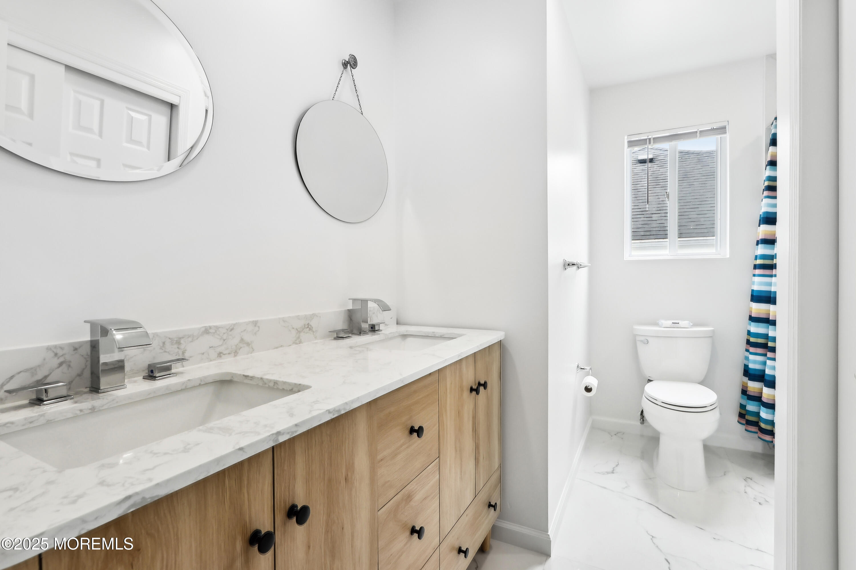 15 Pemberton Drive Matawan, NJ 07747 - Photo 32 of 67 a bathroom with a sink a toilet and a mirror