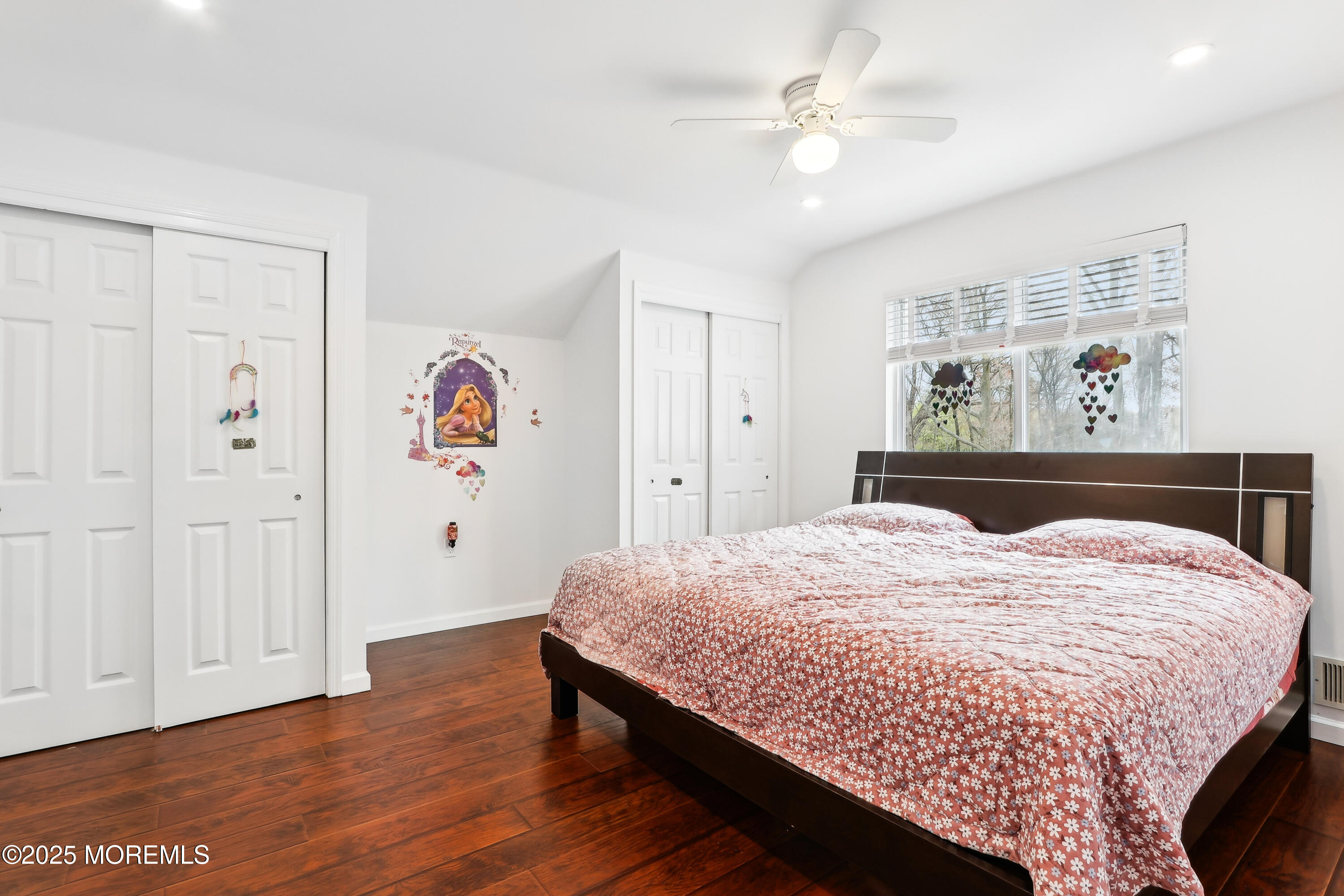 15 Pemberton Drive Matawan, NJ 07747 - Photo 35 of 67 a bedroom with a bed and a chandelier
