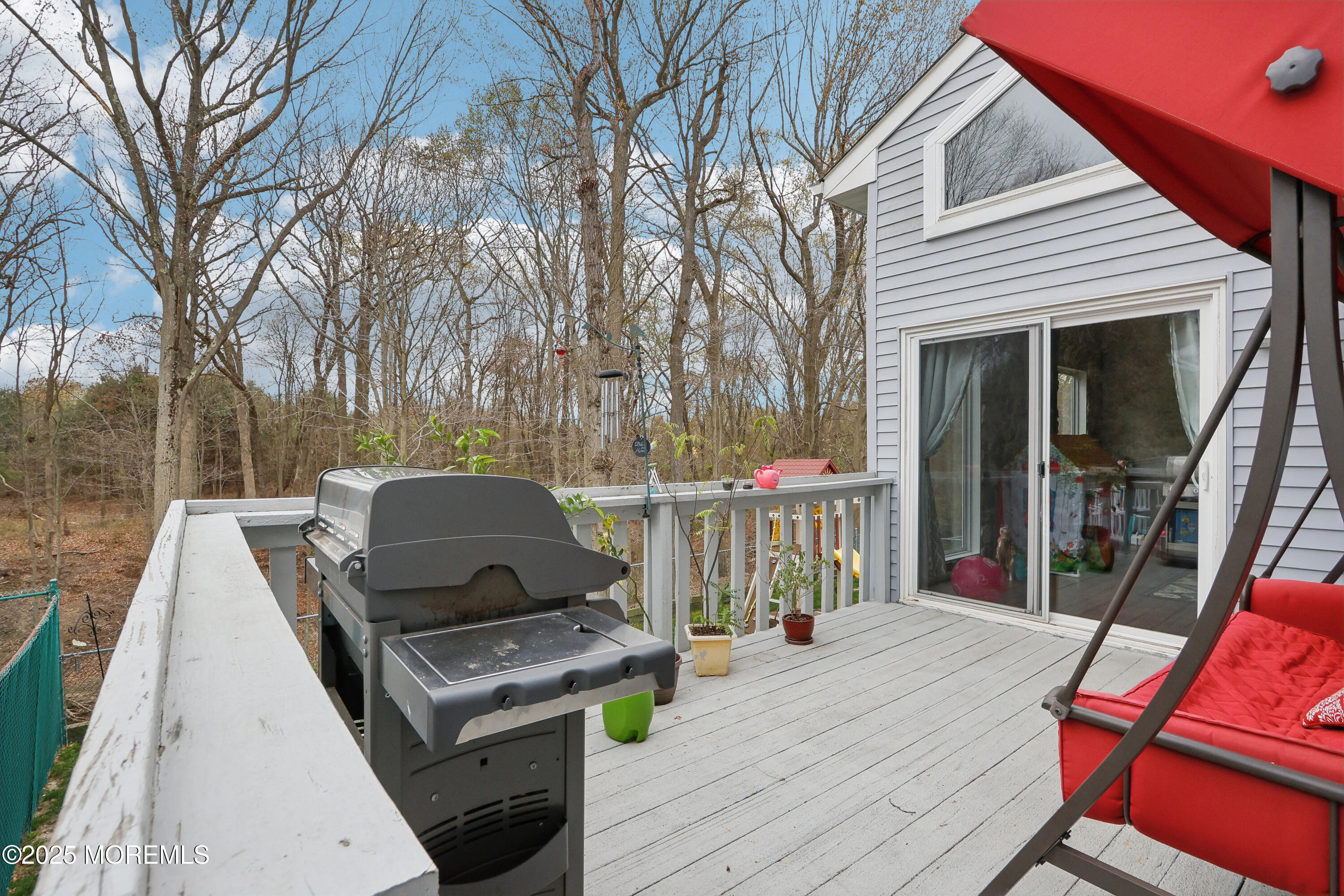 15 Pemberton Drive Matawan, NJ 07747 - Photo 39 of 67 a view of a deck with wooden floor and outdoor seating