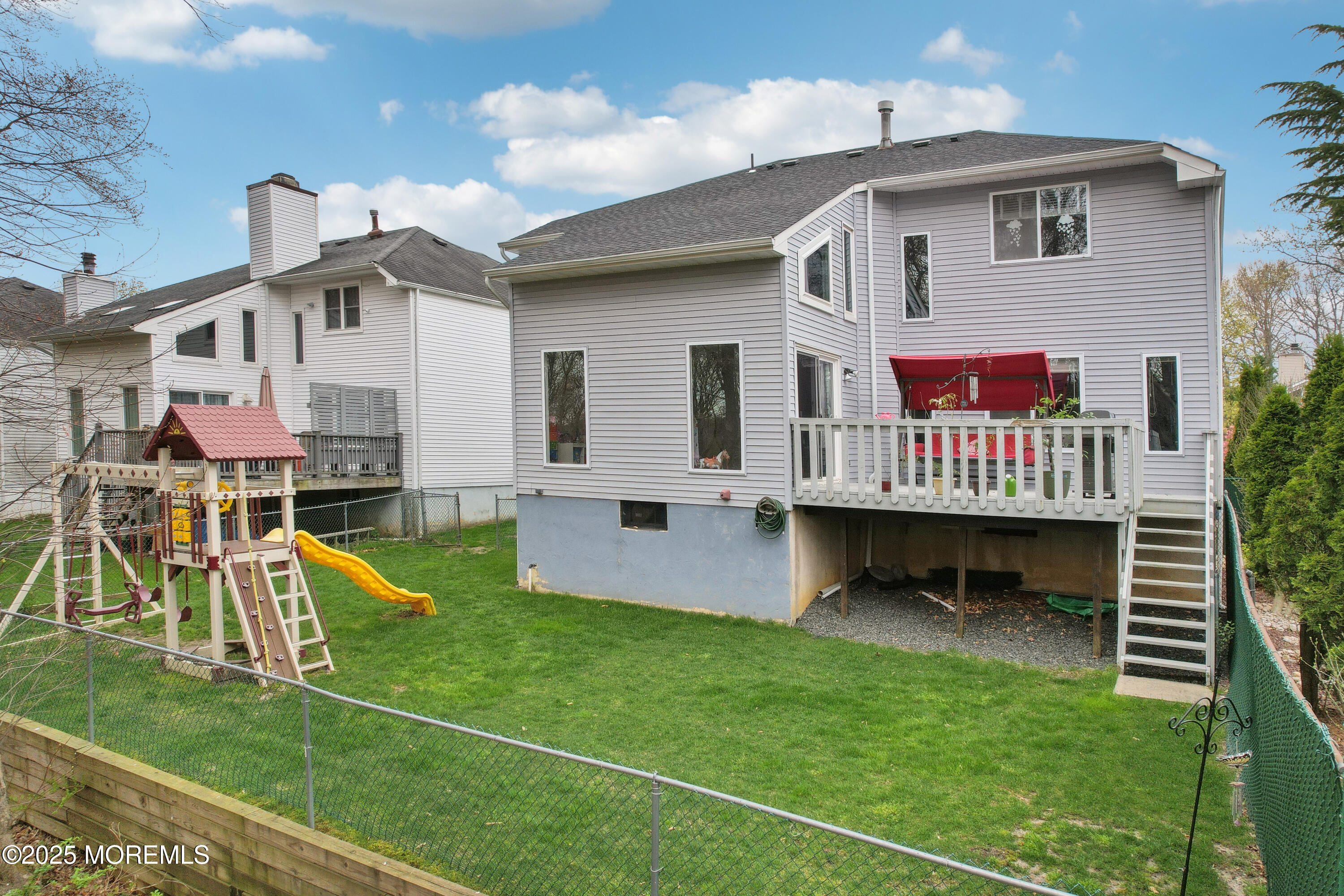 15 Pemberton Drive Matawan, NJ 07747 - Photo 40 of 67 a view of a house with a yard patio and a slide