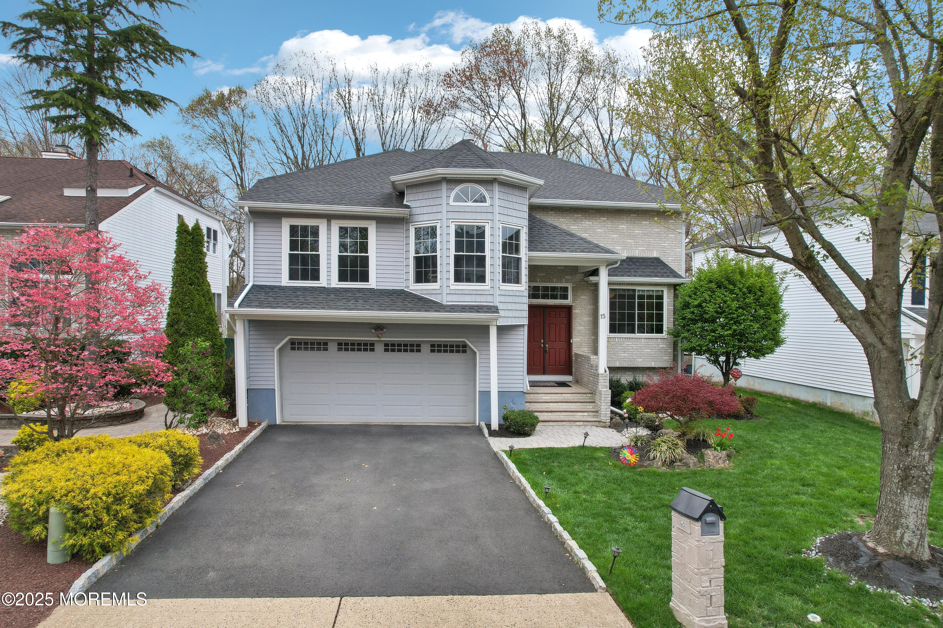 15 Pemberton Drive Matawan, NJ 07747 - Photo 47 of 67 a front view of a house with garden