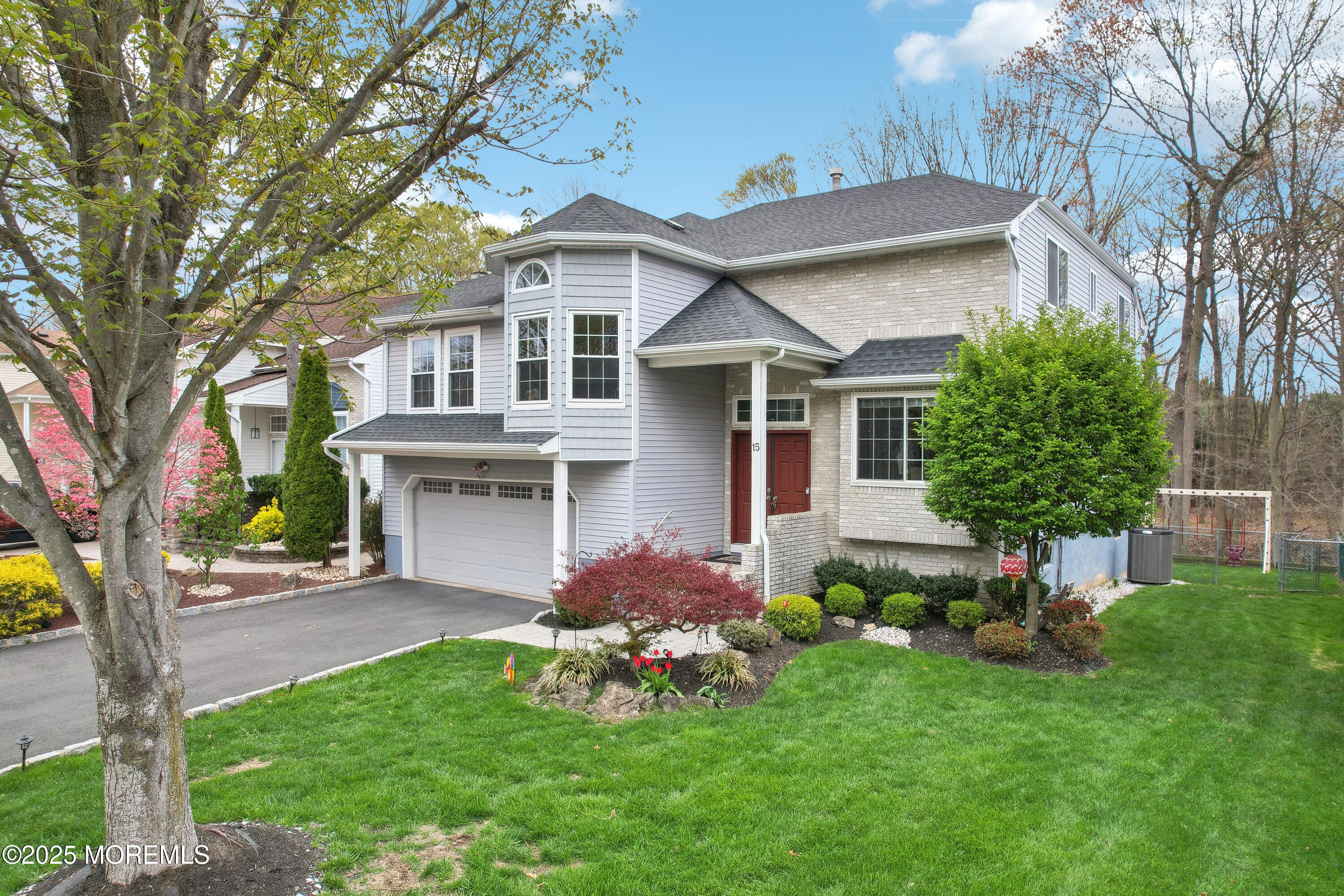 15 Pemberton Drive Matawan, NJ 07747 - Photo 48 of 67 a front view of house with a garden