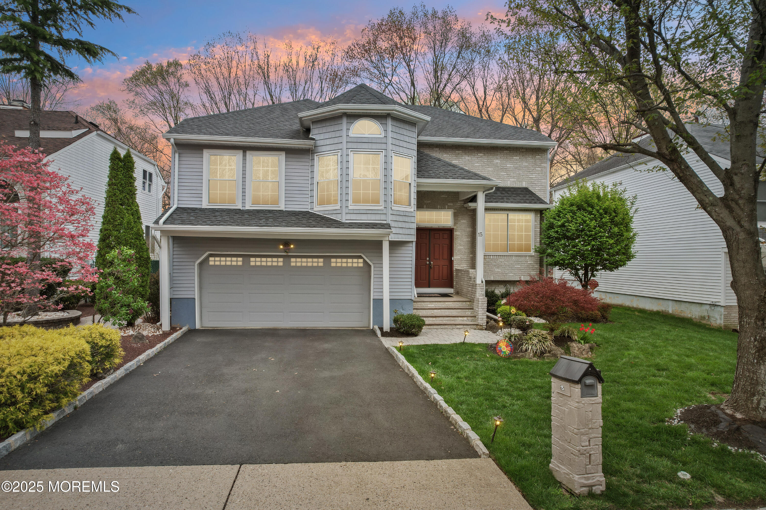 15 Pemberton Drive Matawan, NJ 07747 - Photo 61 of 67 a front view of a house with a garden and plants