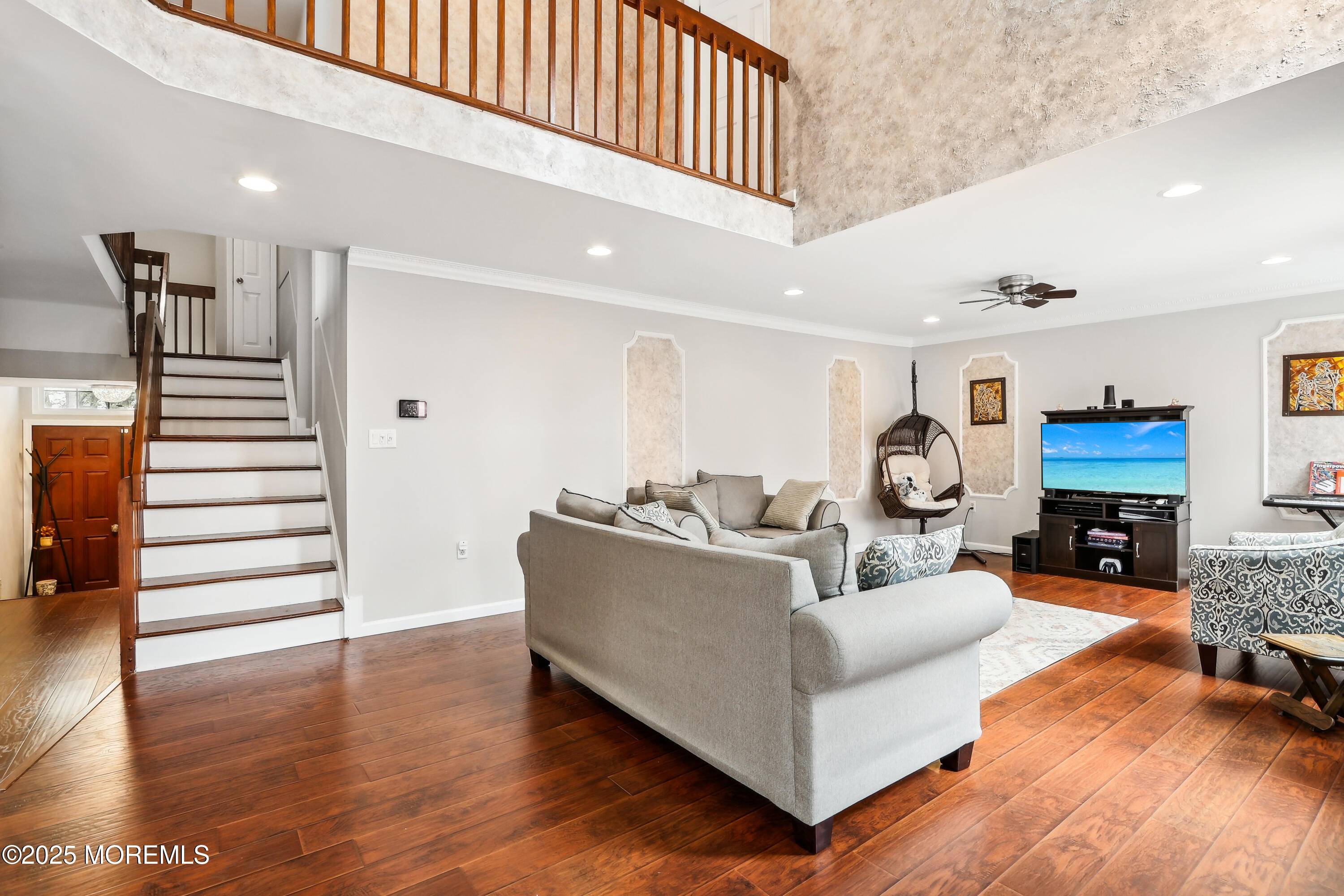 15 Pemberton Drive Matawan, NJ 07747 - Photo 7 of 67 a living room with furniture a fireplace and wooden floor