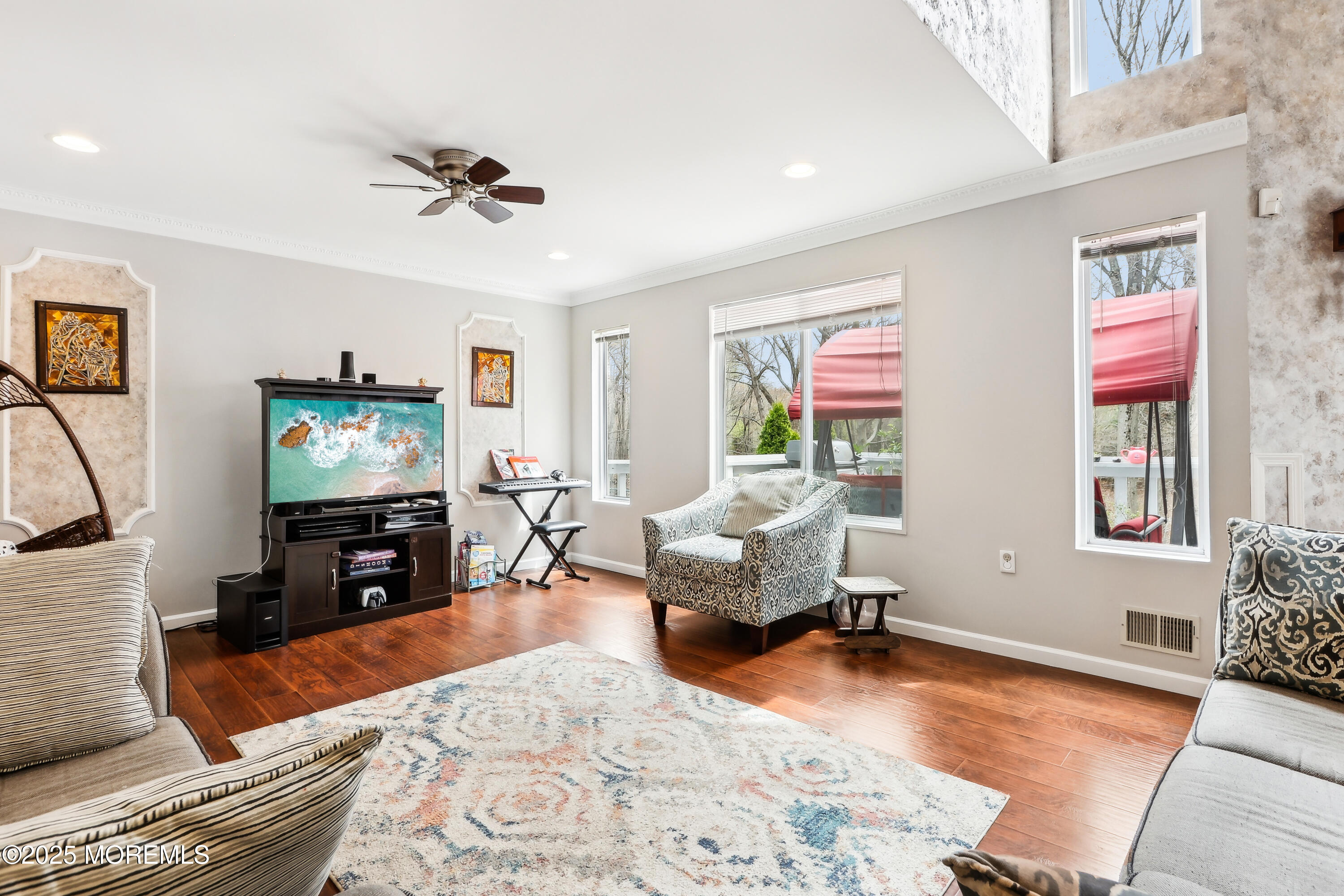 15 Pemberton Drive Matawan, NJ 07747 - Photo 8 of 67 a living room with furniture and a flat screen tv