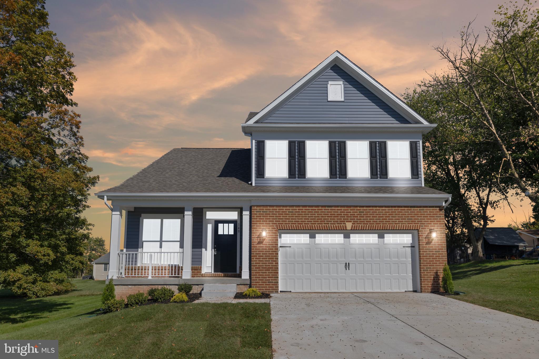 front view of a house with a yard