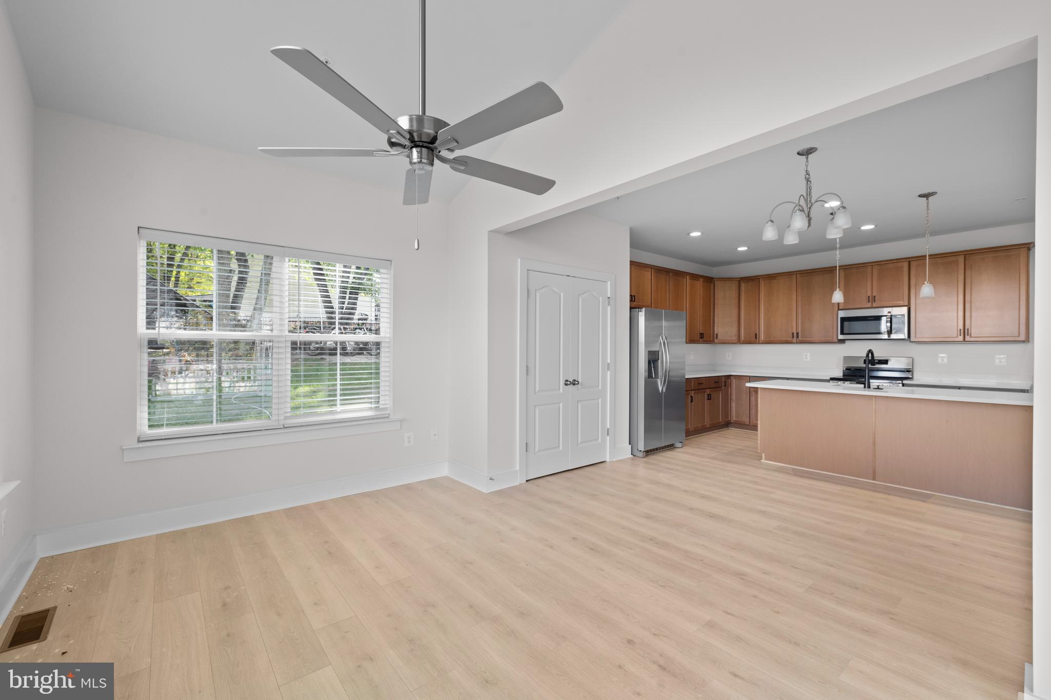 148 West Baltimore Street Taneytown, MD 21787 - Photo 16 of 52 a view of a kitchen with kitchen island a sink stainless steel appliances and cabinets