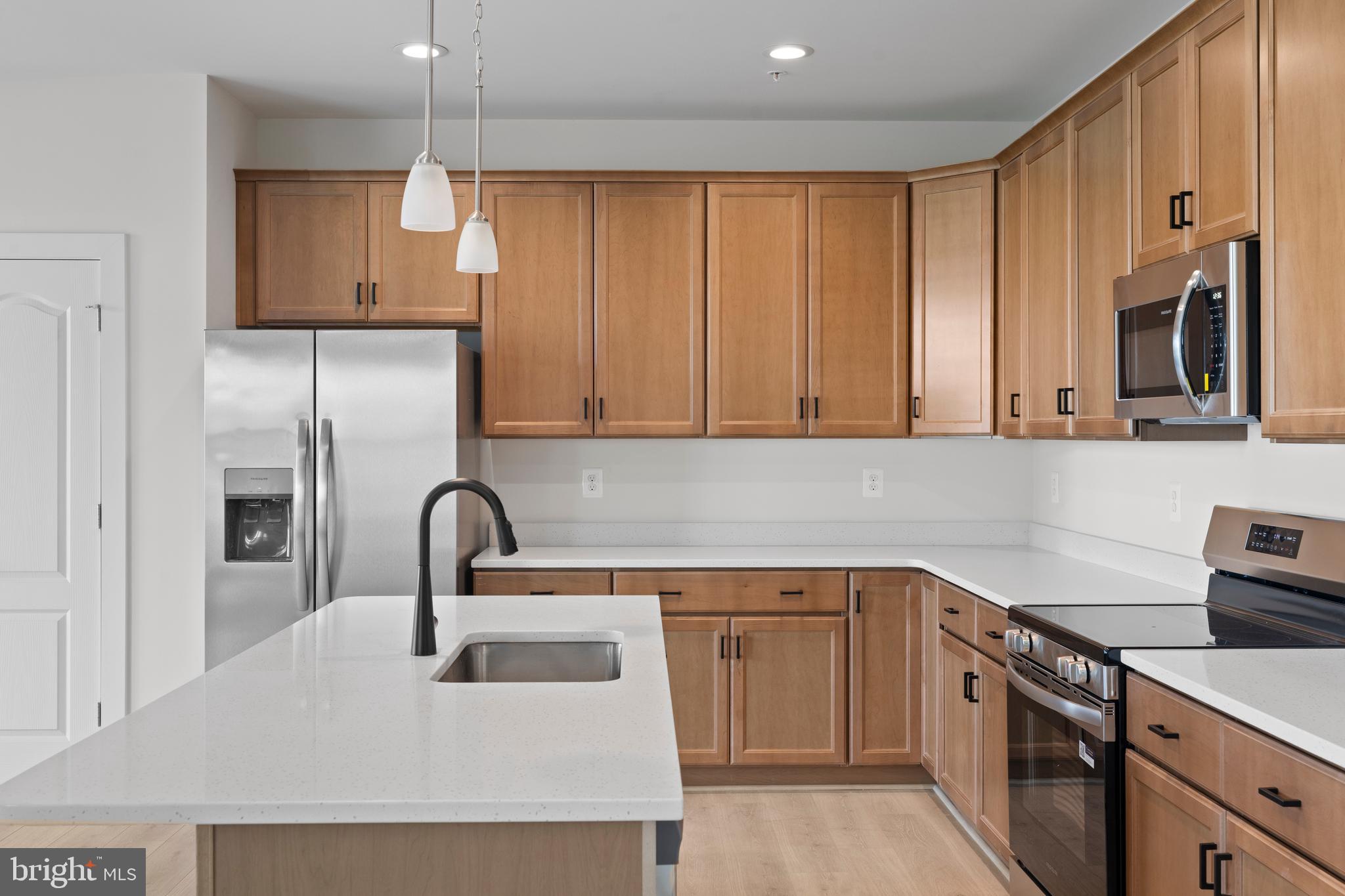 148 West Baltimore Street Taneytown, MD 21787 - Photo 19 of 52 a kitchen with a sink cabinets and appliances
