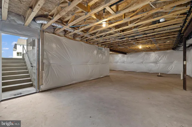 a view of a room with wooden walls