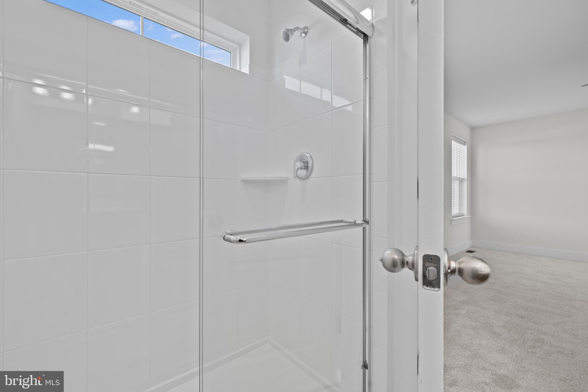 148 West Baltimore Street Taneytown, MD 21787 - Photo 47 of 52 a bathroom with a glass shower door