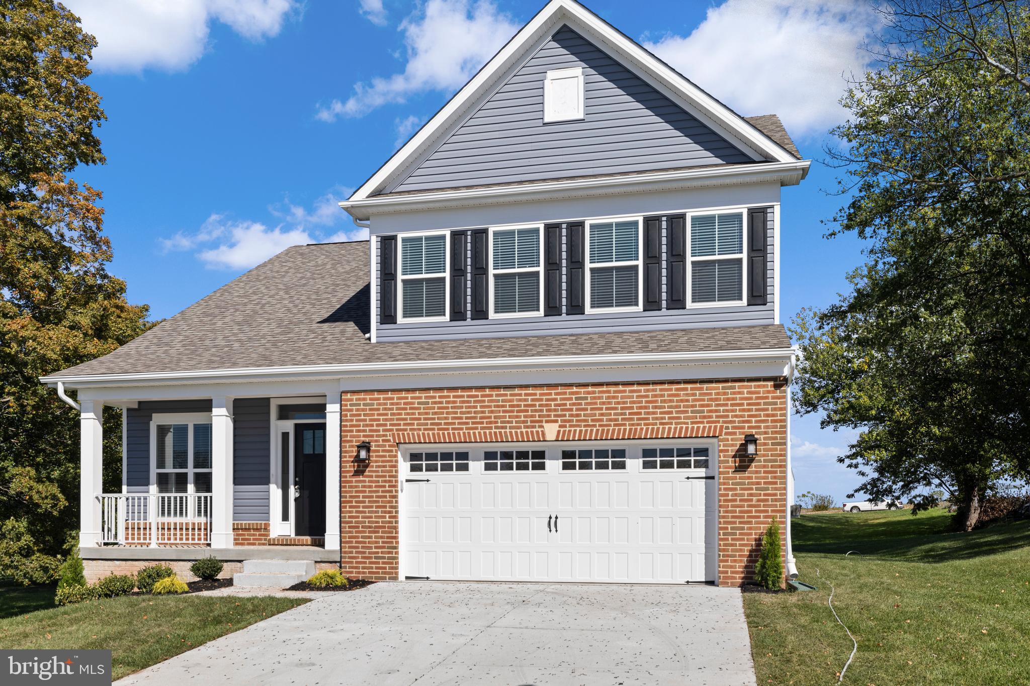 148 West Baltimore Street Taneytown, MD 21787 - Photo 49 of 52 a front view of a house with a garden