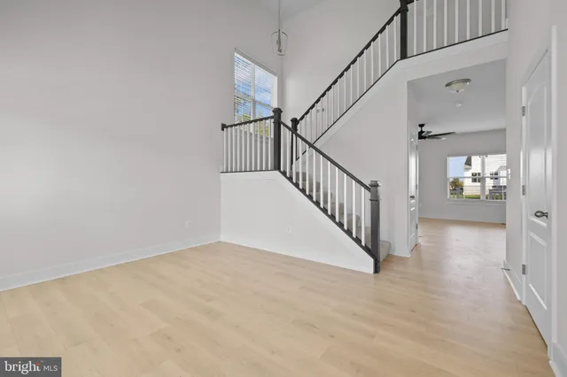 a view of an entryway with wooden floor