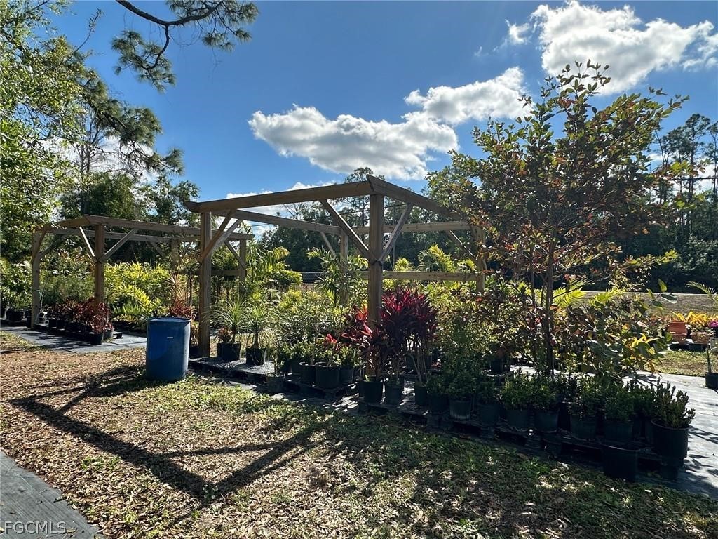 9320 Buckingham Road Fort Myers, FL 33905 - Photo 5 of 19 a view of a garden with plants