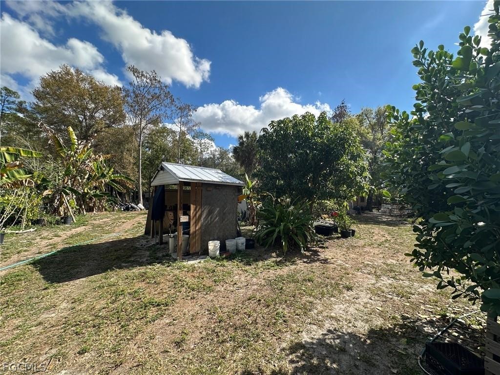 9320 Buckingham Road Fort Myers, FL 33905 - Photo 8 of 19 a view of a house with a yard