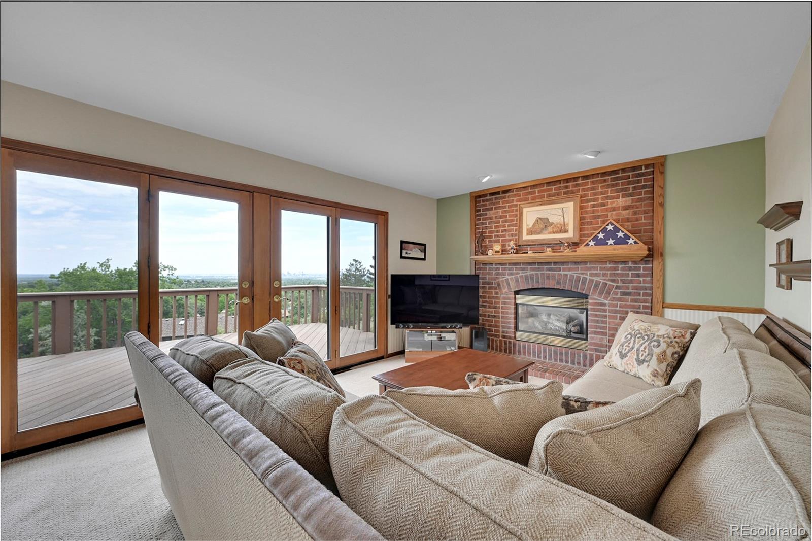 12377 West Louisiana Avenue Lakewood, CO 80228 - Photo 13 of 50 a living room with furniture large windows and a fireplace