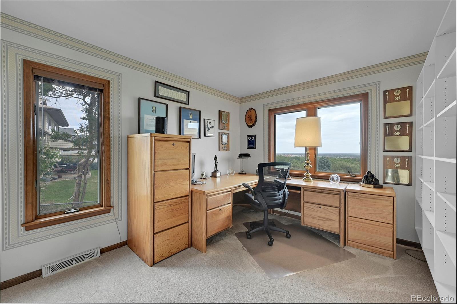 12377 West Louisiana Avenue Lakewood, CO 80228 - Photo 24 of 50 a room with furniture a window and a fireplace