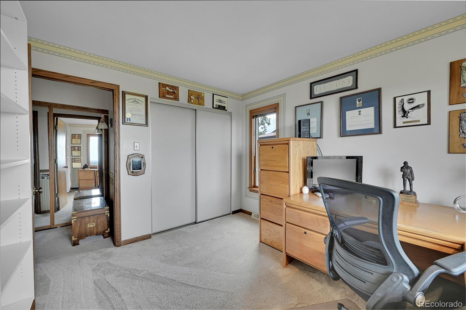 12377 West Louisiana Avenue Lakewood, CO 80228 - Photo 25 of 50 a bedroom with furniture and a window
