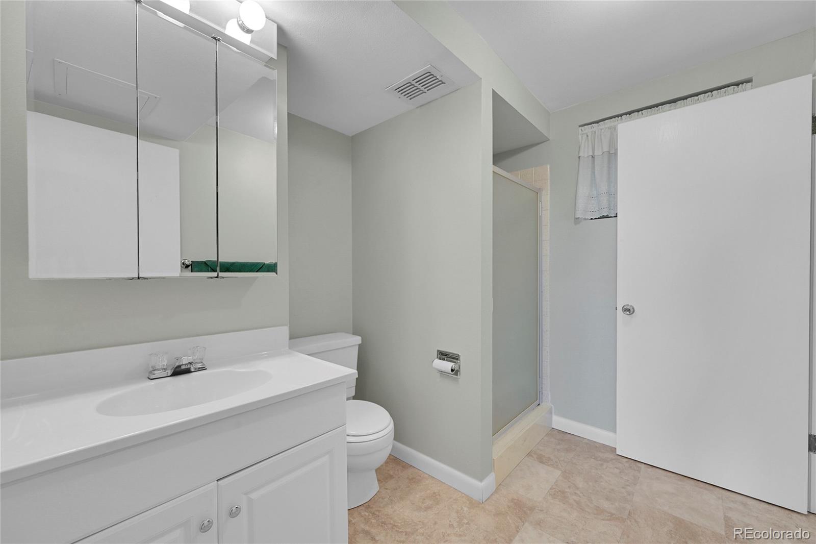 12377 West Louisiana Avenue Lakewood, CO 80228 - Photo 28 of 50 a bathroom with a sink and a toilet