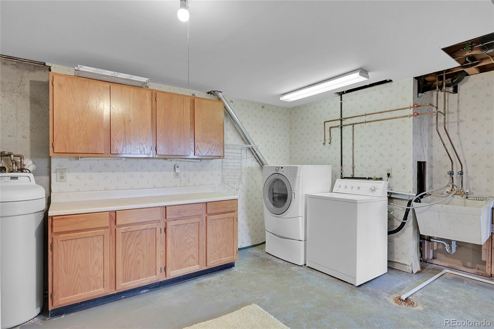 12377 West Louisiana Avenue Lakewood, CO 80228 - Photo 32 of 50 a utility room with dryer and washer