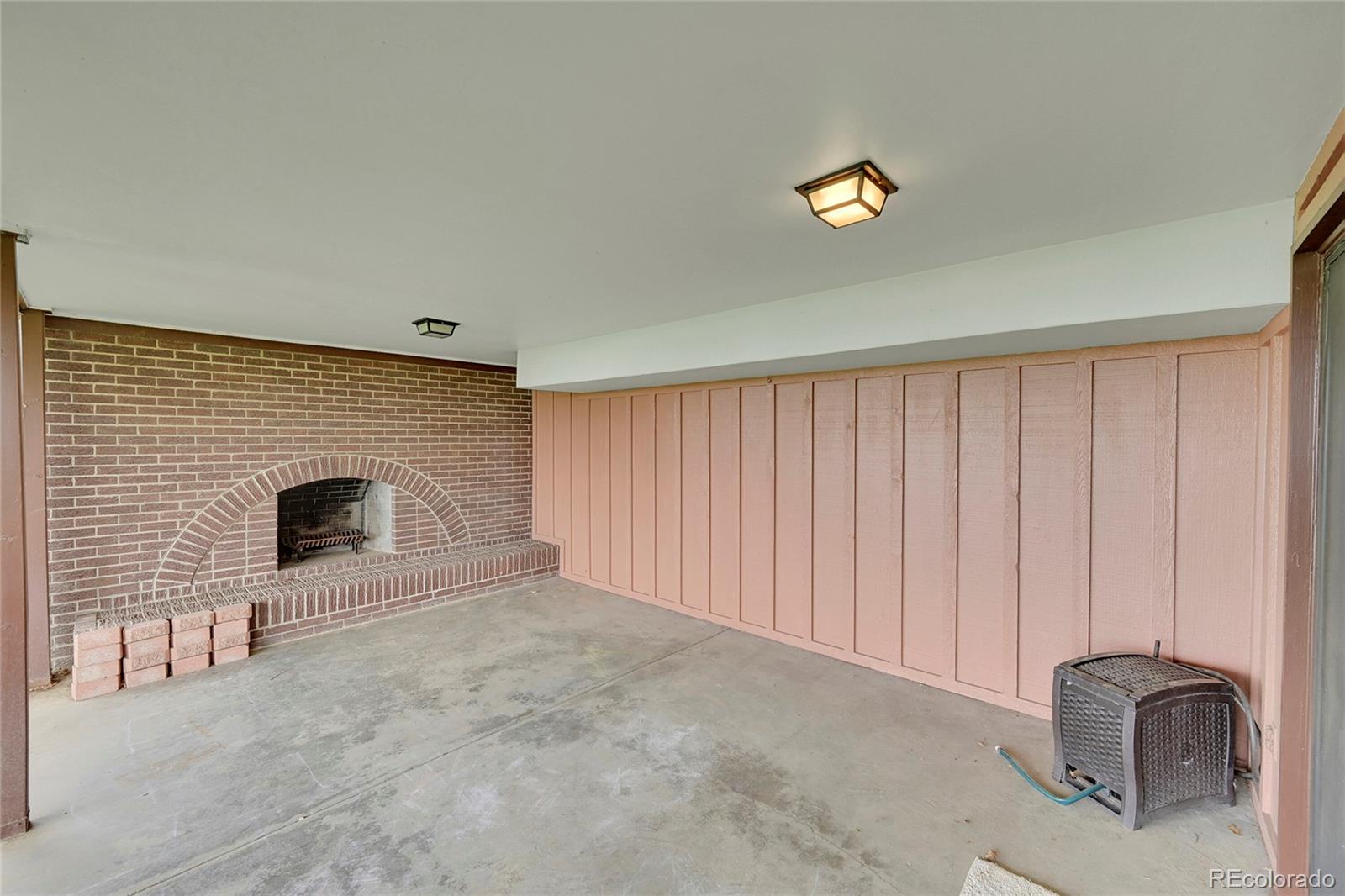 12377 West Louisiana Avenue Lakewood, CO 80228 - Photo 33 of 50 a view of an empty room with a fireplace and a window