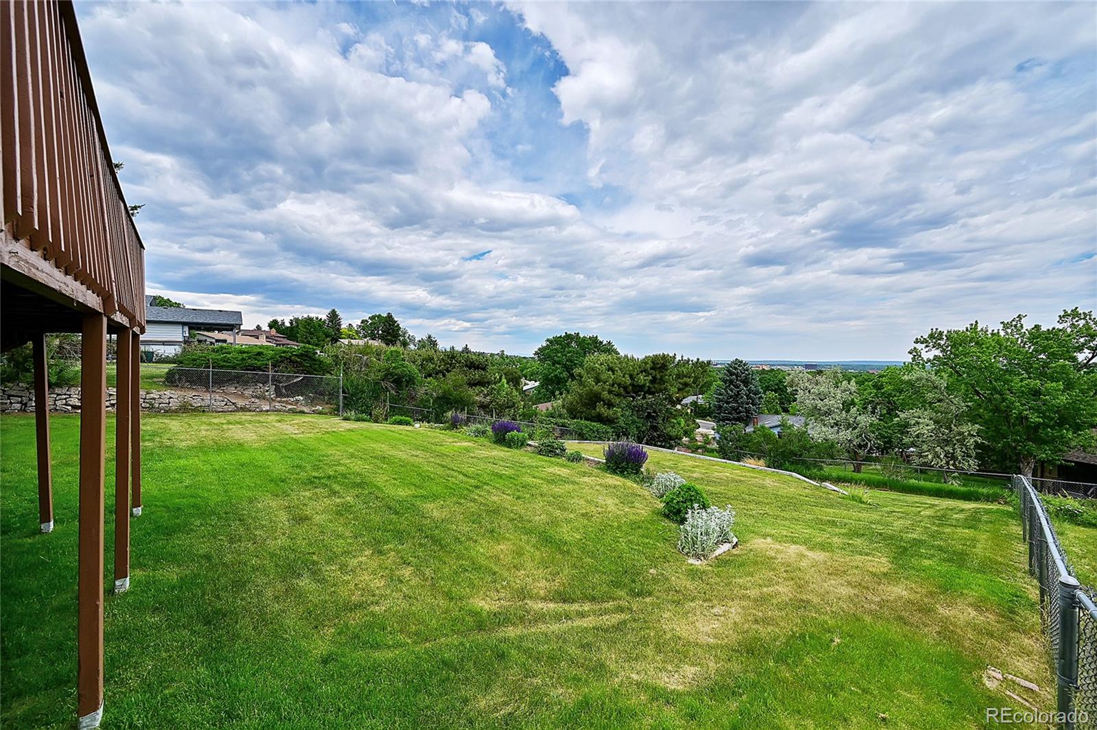 12377 West Louisiana Avenue Lakewood, CO 80228 - Photo 35 of 50 a view of a garden with a building in the background
