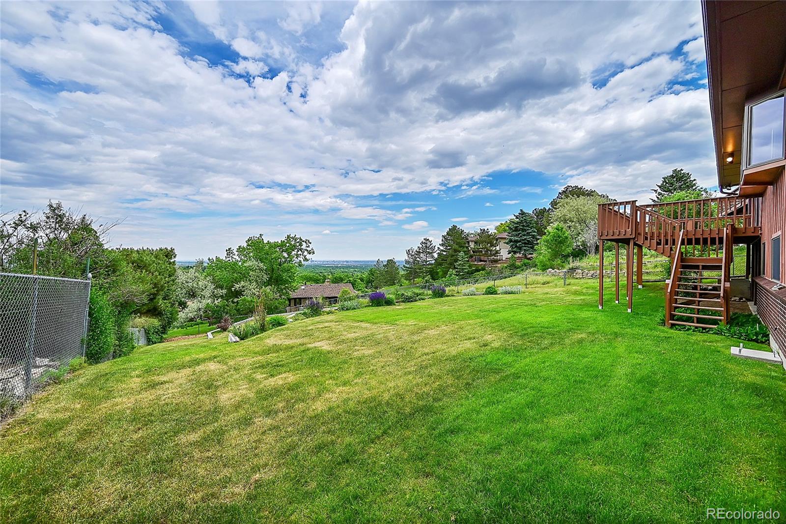12377 West Louisiana Avenue Lakewood, CO 80228 - Photo 38 of 50 a view of a garden with a building in the background
