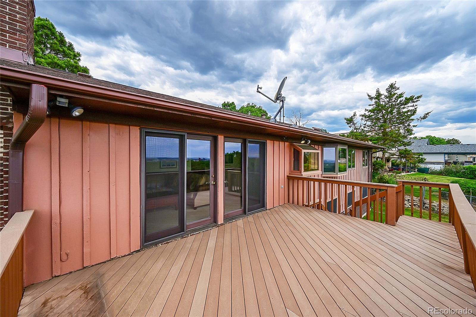 12377 West Louisiana Avenue Lakewood, CO 80228 - Photo 41 of 50 a view of a house with a roof deck