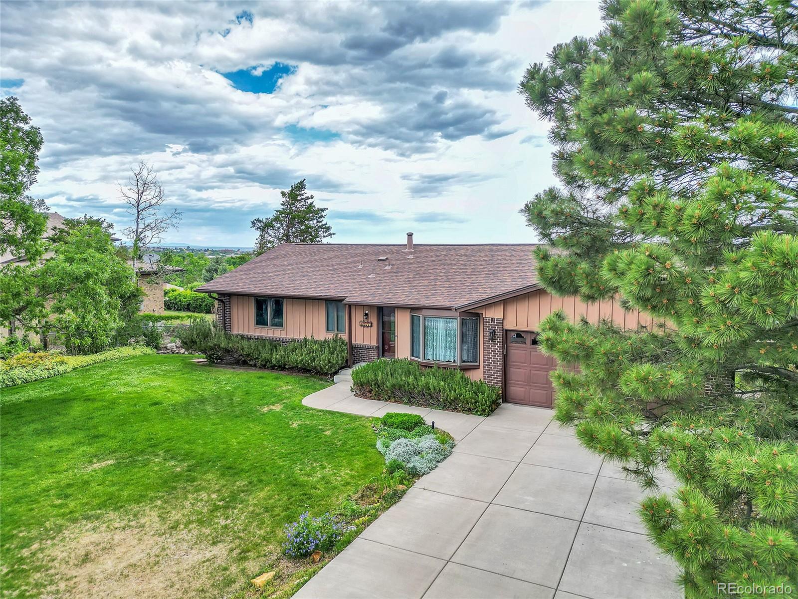 12377 West Louisiana Avenue Lakewood, CO 80228 - Photo 44 of 50 a view of a yard in front of house