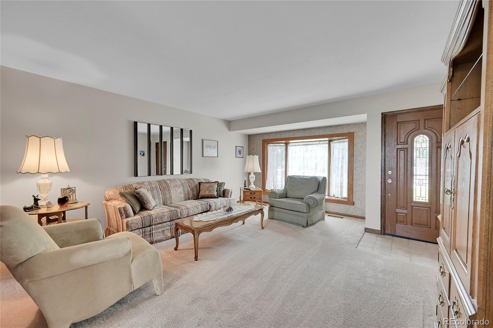 12377 West Louisiana Avenue Lakewood, CO 80228 - Photo 5 of 50 a living room with furniture and a window