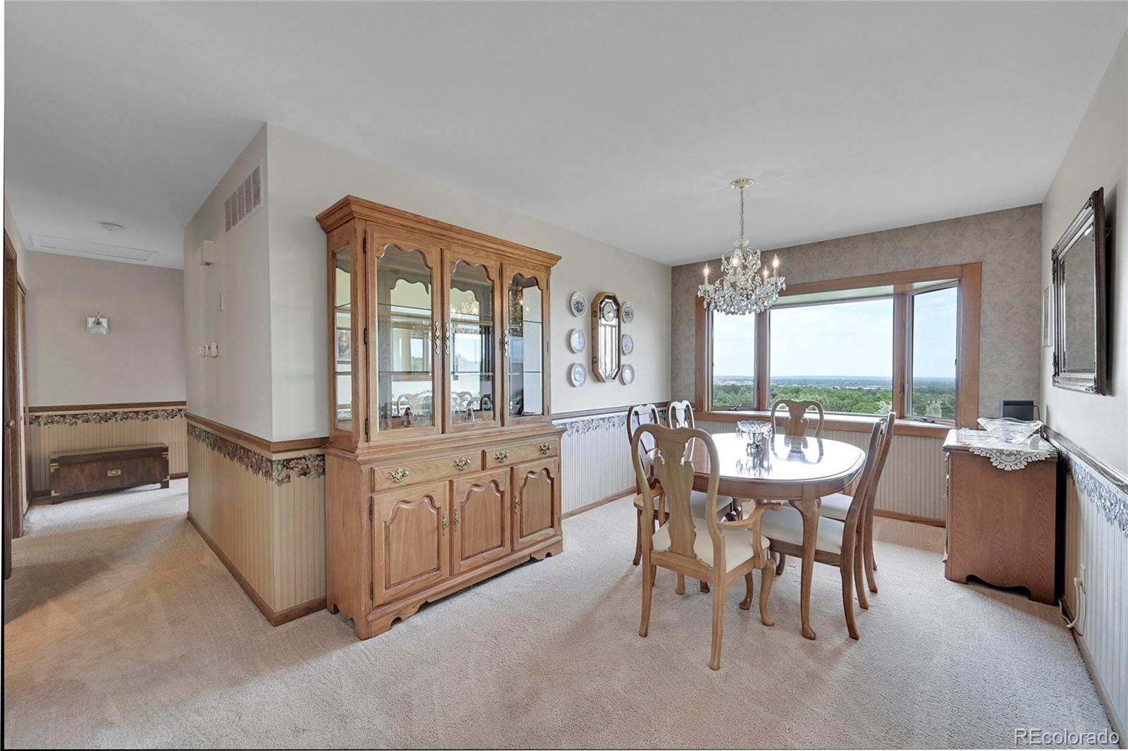 12377 West Louisiana Avenue Lakewood, CO 80228 - Photo 6 of 50 a dining room with furniture a chandelier and window