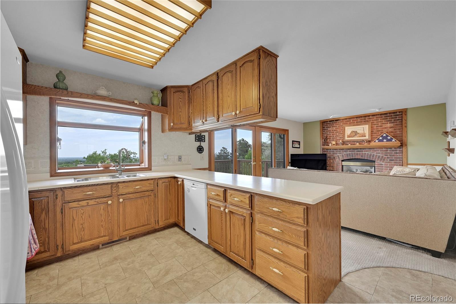 12377 West Louisiana Avenue Lakewood, CO 80228 - Photo 9 of 50 a kitchen with cabinets and window