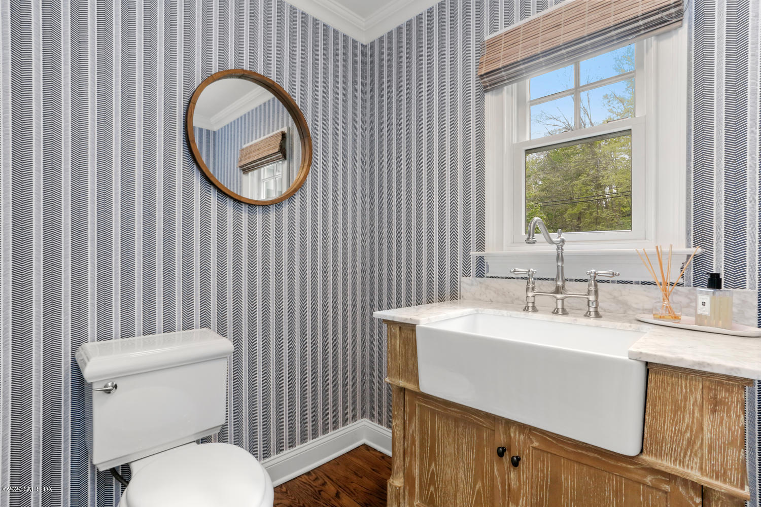 277 Cognewaugh Road Cos Cob, CT 06807 - Photo 14 of 34 a bathroom with a toilet a sink and a mirror